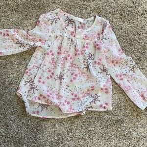 Sheer top. Cute with skinny jeans